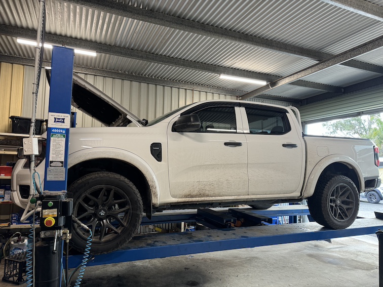 Work ute on the hoist for underbody service